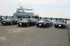 limousine cars on a marina
