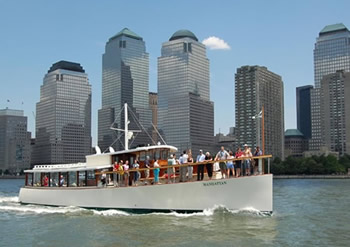 Manhattan Yacht sailing while carrying tourists enjoying the pretty views of NYC