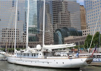 Arabella Yacht in marina with nice designed buildings in the back
